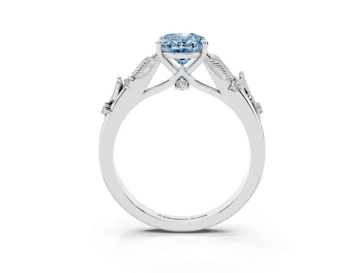 Fancy Blue Oval Cut Diamond Solitaire Ring with Leaf Motif Band and Four-Prong Setting Silver