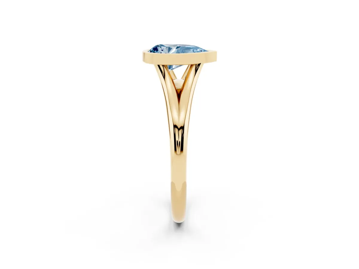 Fancy Blue Bezel Set Pear Cut Cut Solitaire Ring with Tapered Band Yellow gold