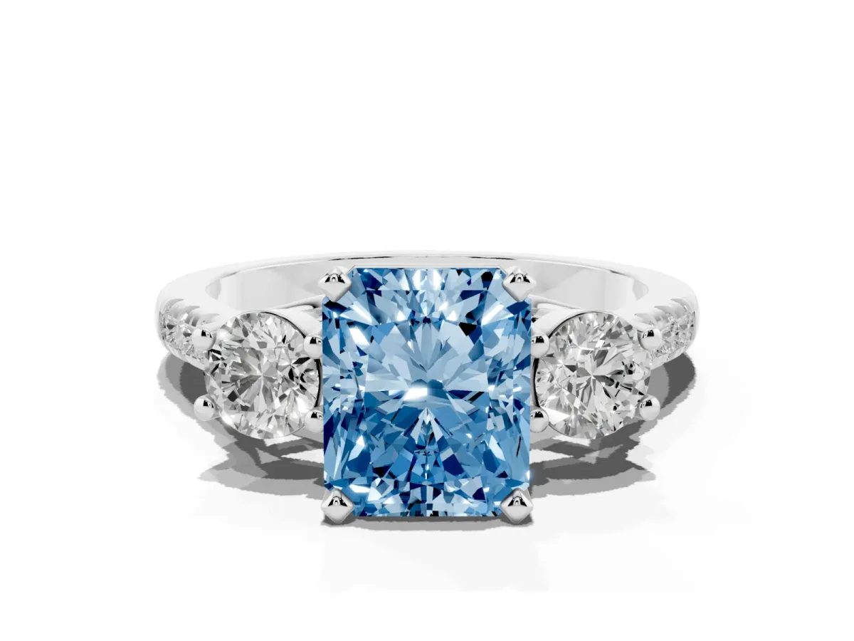 Fancy Blue Three-Stone Radiant Cut Diamond Pavé Band with Four-Prong Setting Platinum