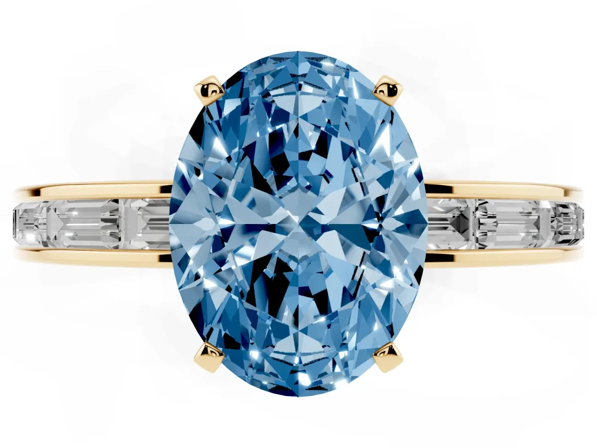 Fancy Blue Oval Cut Solitaire Diamond Ring with Channel-Set Baguette Band and Four-Prong Setting Yellow gold