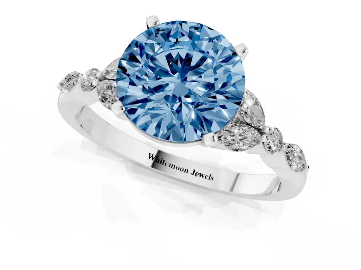 Fancy Blue Round Cut Diamond Solitaire Ring with Side Stones and Four-Prong Setting White gold