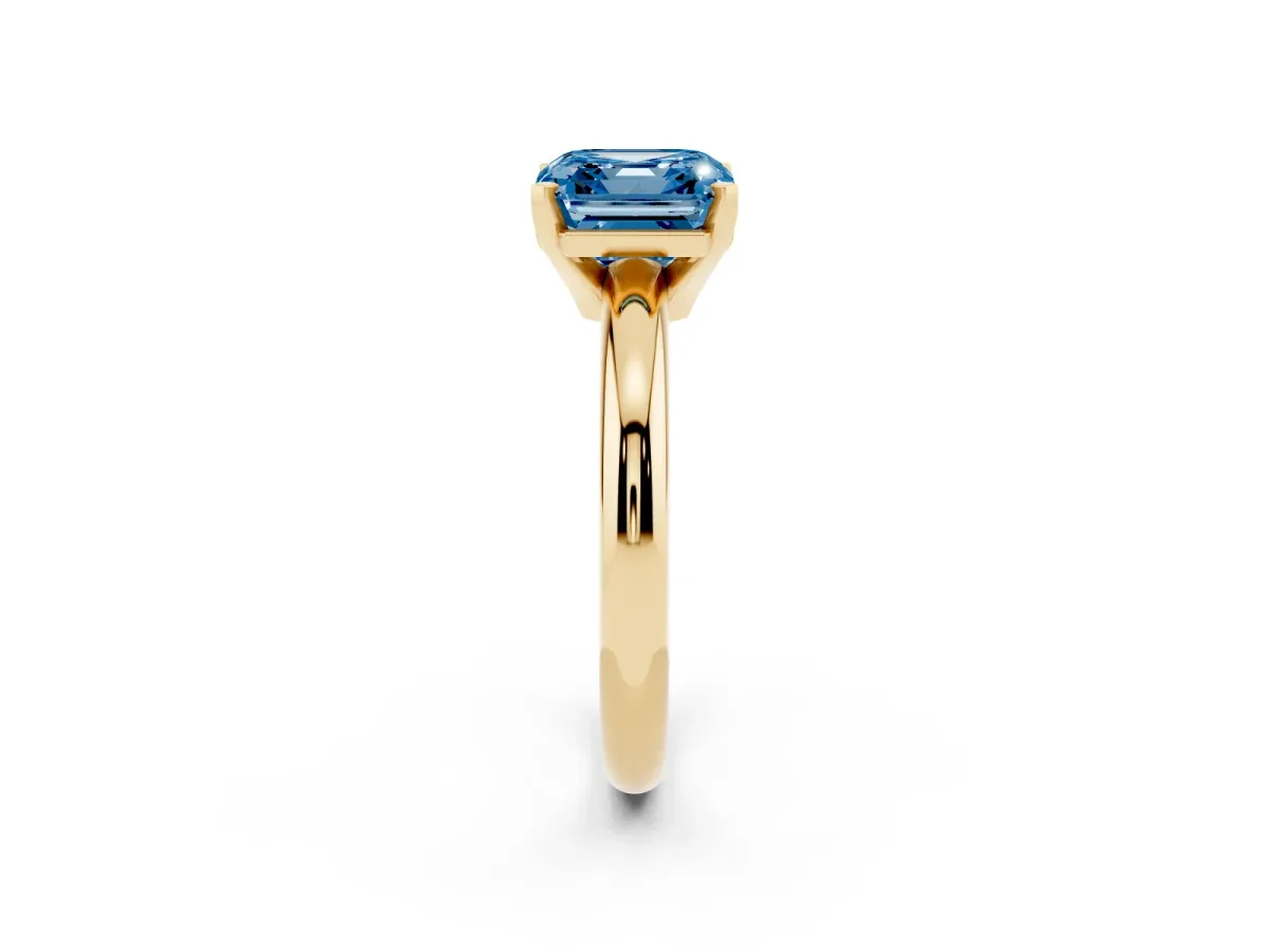 Fancy Blue Asscher Cut Diamond Solitaire Engagement Ring with Round Band and Four-Prong Setting Yellow gold