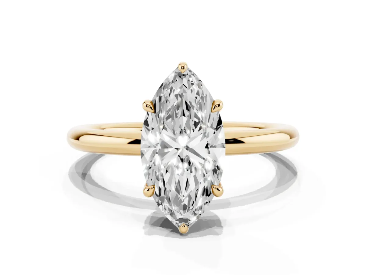 Marquise Cut Diamond Solitaire Ring with Thin Band and Four-Prong Setting Yellow gold