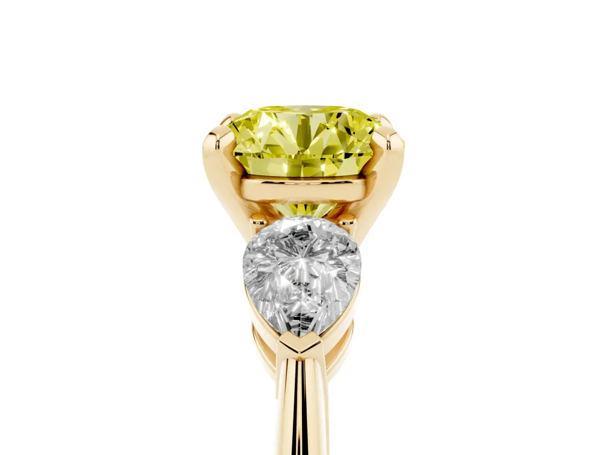 Fancy Yellow Three-Stone Round Cut Diamond Ring with Pear Side Stones and Four-Prong Setting Yellow gold