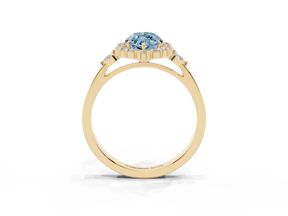 Fancy Blue Marquise Cut Diamond Halo Ring with Pear Side Stones and Prong Setting Yellow gold