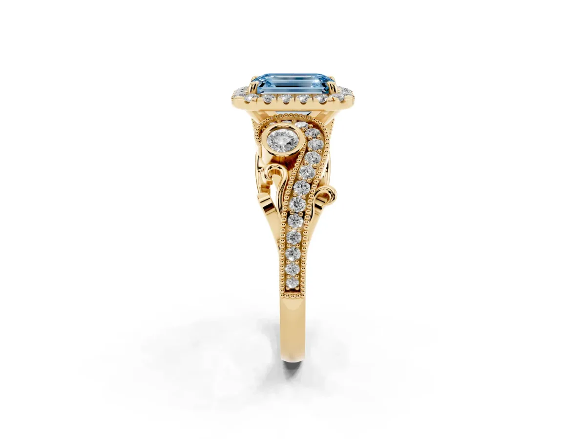 Fancy Blue Emerald Cut Diamond Halo Ring with Milgrain Pavé Band and Four-Prong Setting Yellow gold