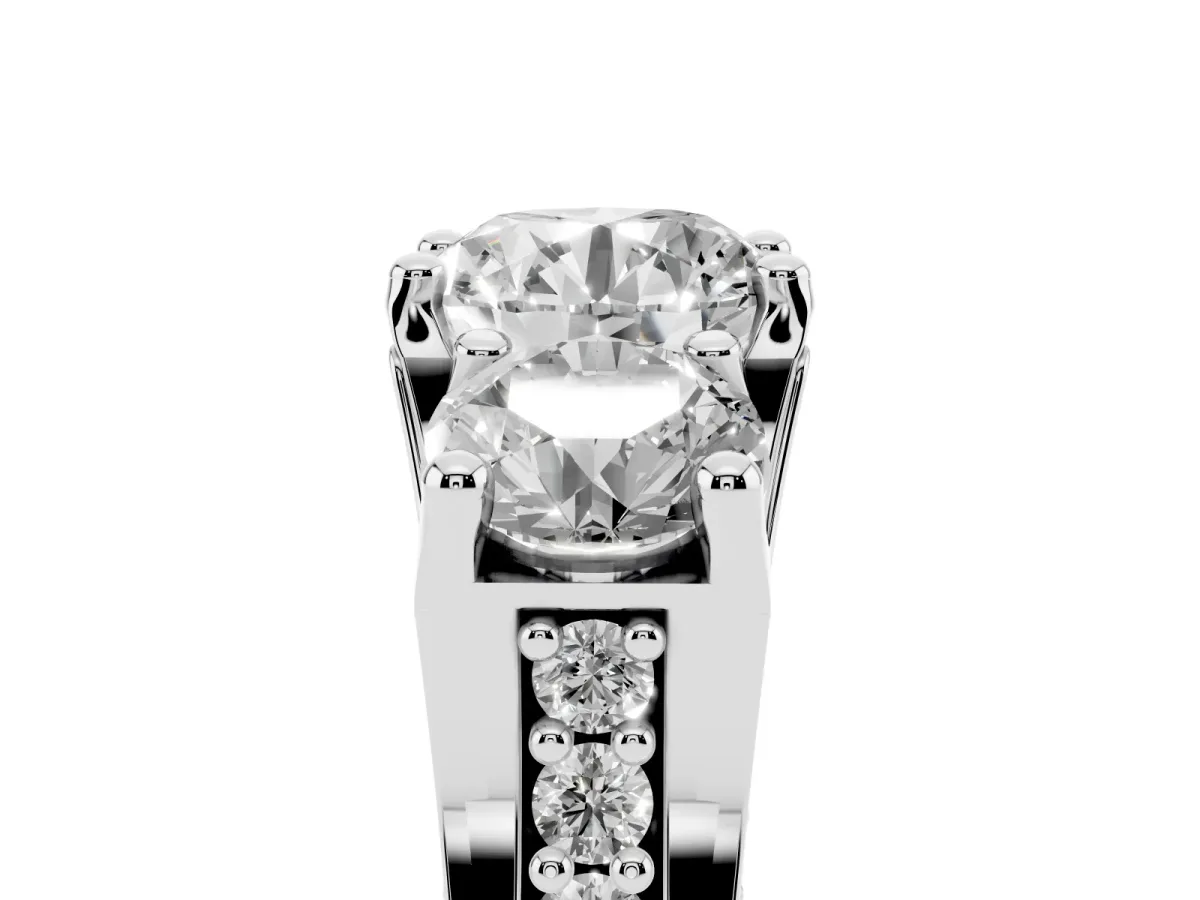 Round Cut Diamond Three-Stone Ring with Channel Set Band and Four-Prong Setting Silver