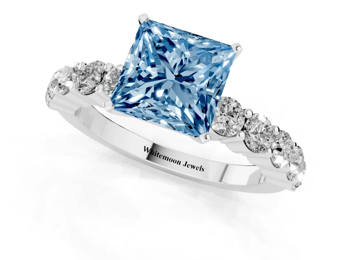 Fancy Blue Princess Cut Diamond Solitaire Ring with Shared Prong Round Side Stones Platinum