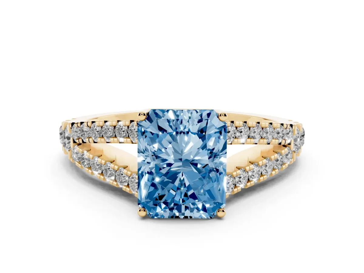 Fancy Blue Radiant Cut Diamond Split Shank Engagement Ring with Round Pavé and Prong Setting Yellow gold