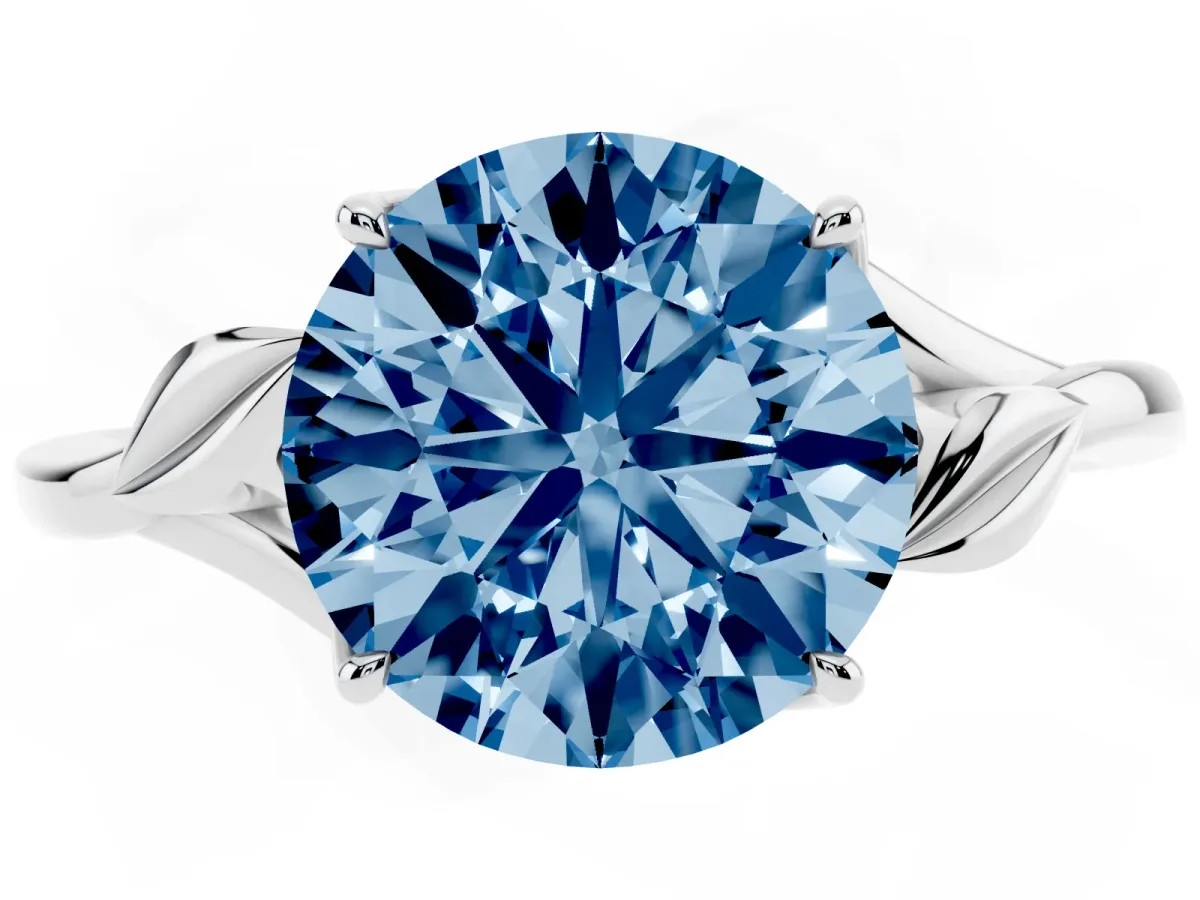 Fancy Blue Round Cut Diamond Solitaire Ring with Twist Band and Four-Prong Setting Silver