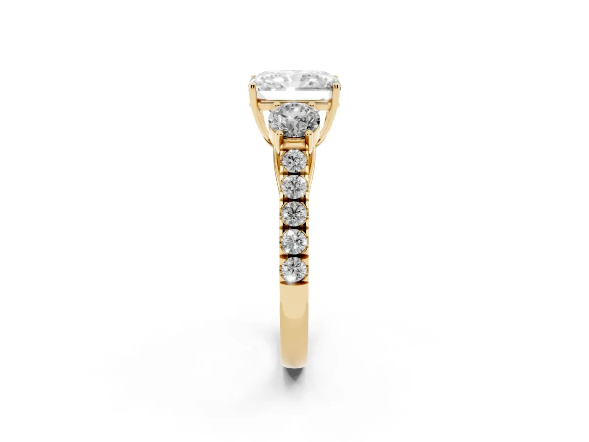 Radiant Cut Cut Diamond Three-Stone Ring with Round Side Stones and Pavé Band Yellow gold