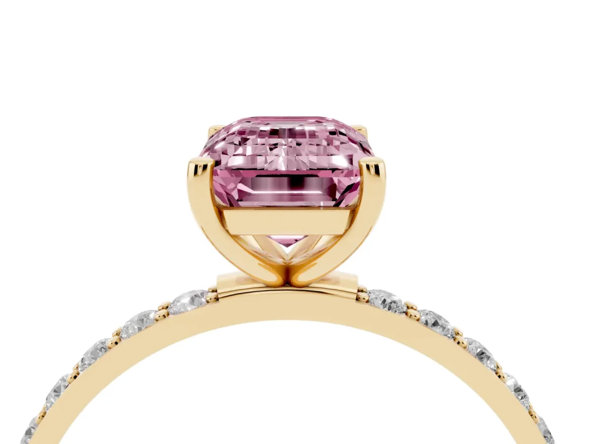 Fancy Pink Emerald Cut Diamond Solitaire Ring with Round Pavé Shoulders and Prong Setting Yellow gold
