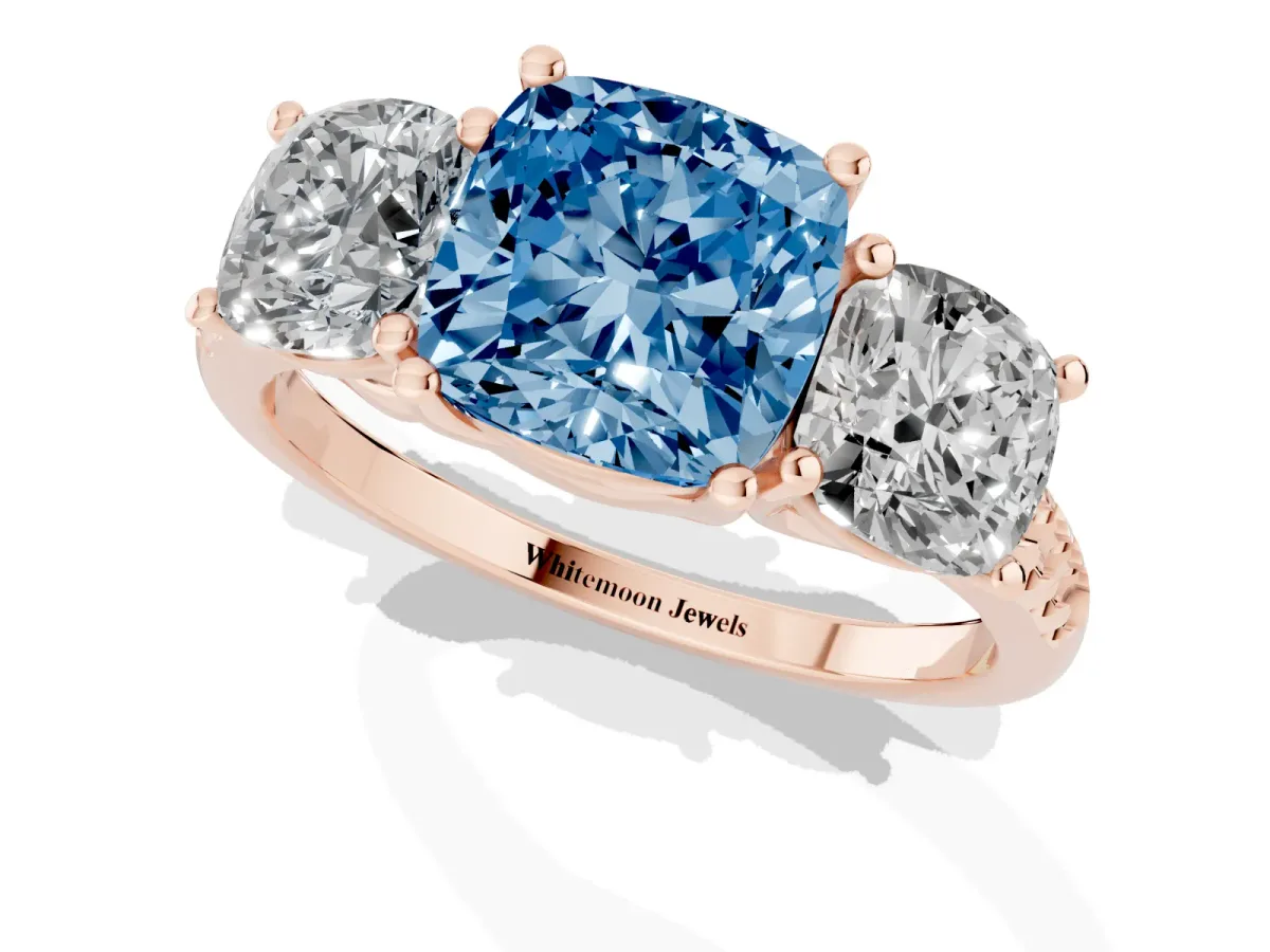 Fancy Blue Three-Stone Cushion Cut Diamond Ring with Round Pavé Band and Prong Setting Rose gold