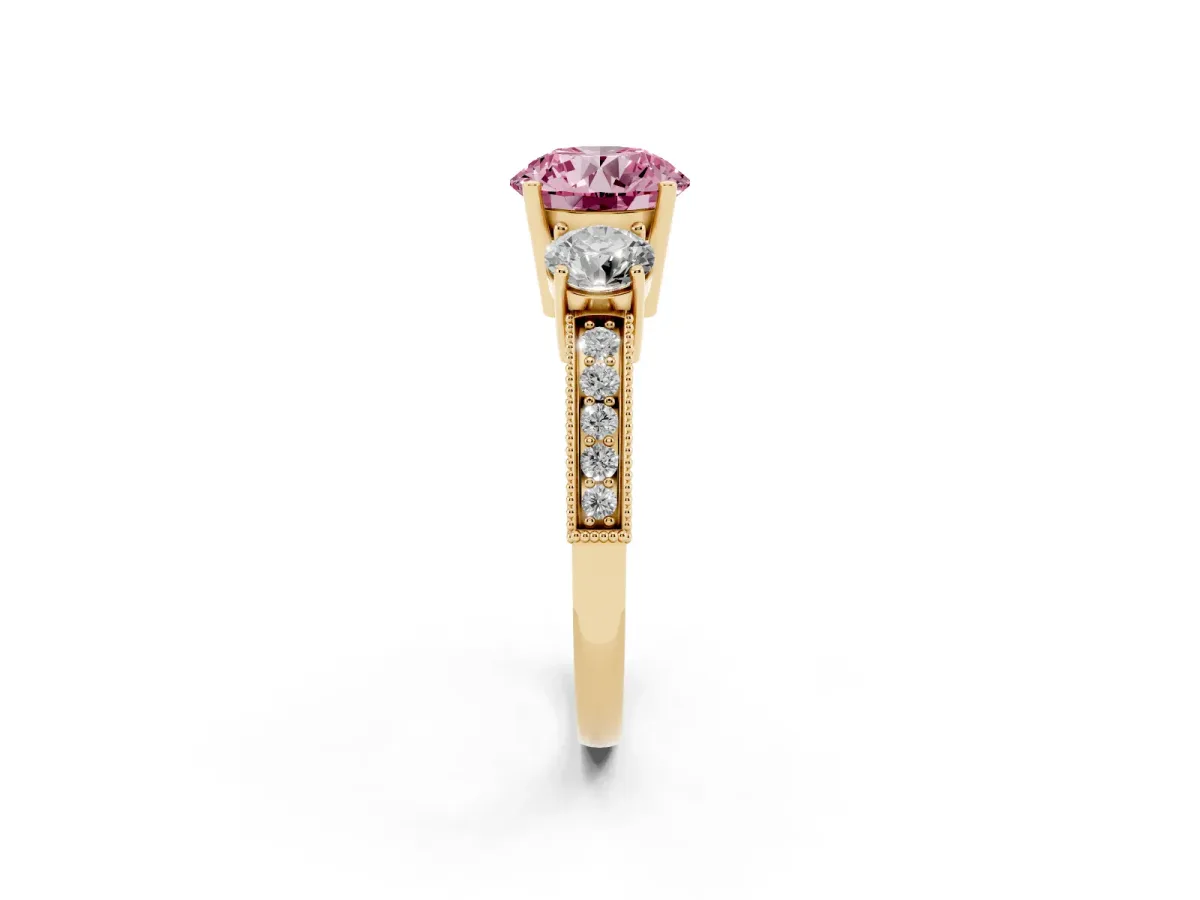 Fancy Pink Round Cut Three-Stone Diamond Ring with Pavé Band and Four-Prong Setting Yellow gold
