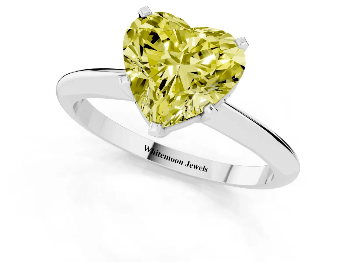 Fancy Yellow Heart Cut Cut Solitaire Ring with Four-Prong Setting on a Classic Band Silver