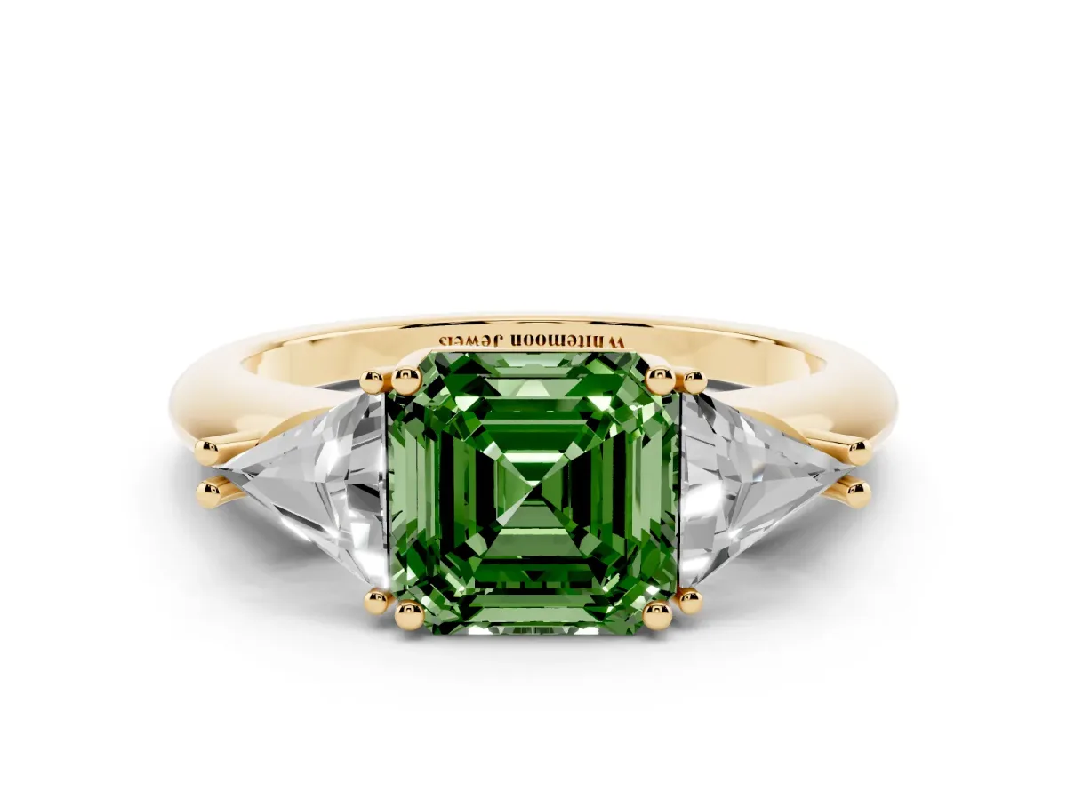 Fancy Green Three-Stone Asscher Cut Diamond Engagement Ring with Trillion Side Stones and Prong Setting Yellow gold