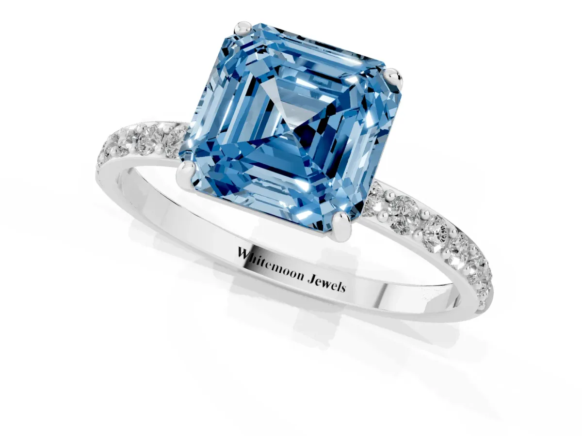 Fancy Blue Asscher Cut Diamond Solitaire Ring with Round Pavé Shoulders and Prong Setting Platinum