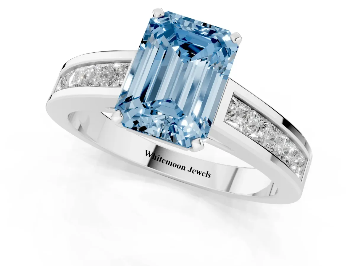 Fancy Blue Emerald Cut Solitaire Diamond Ring with Channel-Set Band and Four-Prong Setting Silver