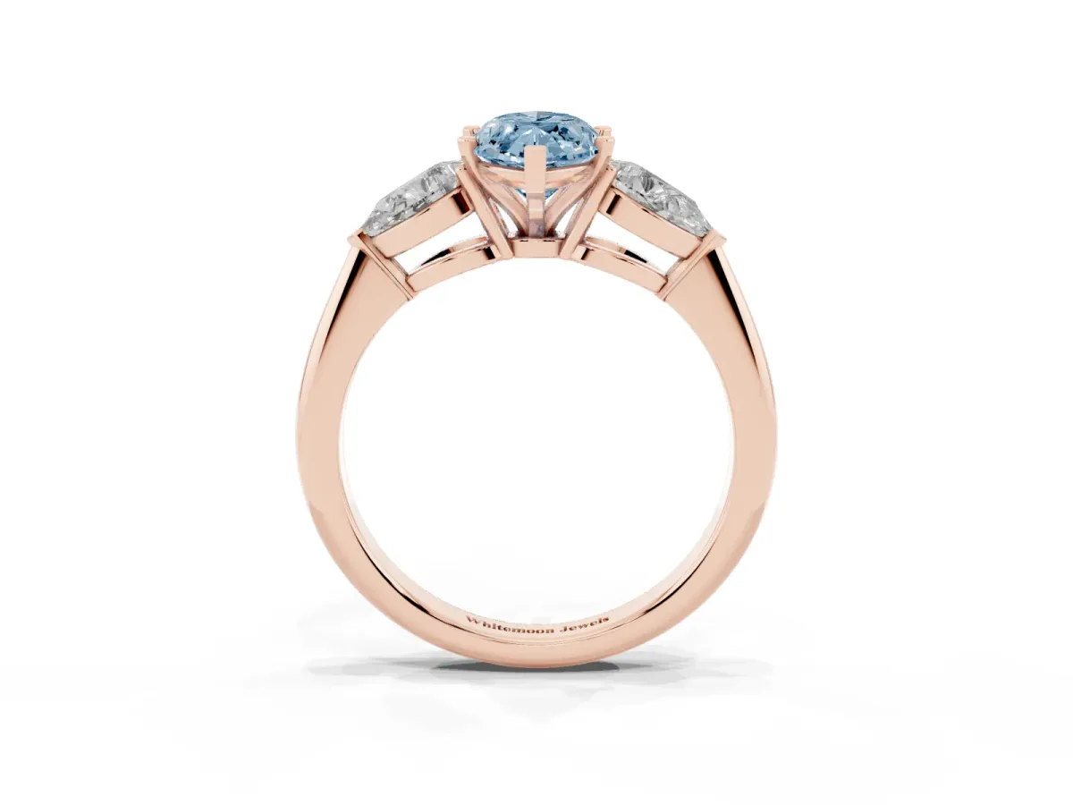 Fancy Blue Three-Stone Marquise Cut Diamond Ring with Pear Side Stones and Four-Prong Setting Rose gold