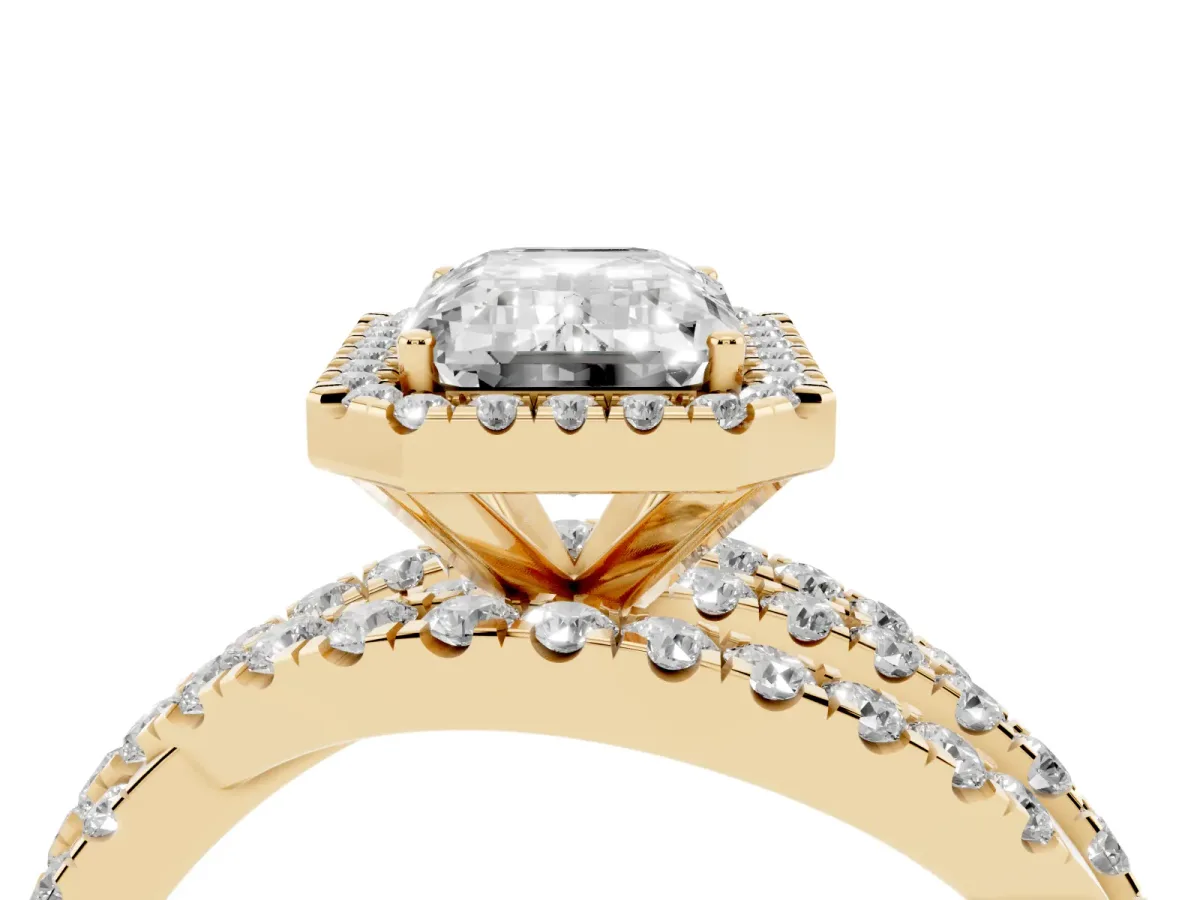 Emerald Cut Diamond Halo Ring with Round Split Shank and Prong Setting Yellow gold
