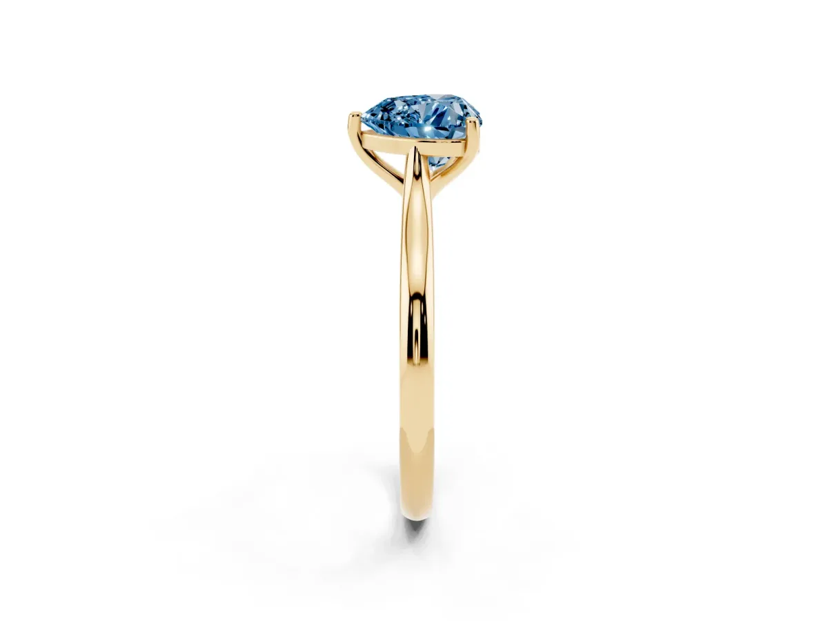 Fancy Blue Heart Cut Cut Solitaire Ring with Cathedral Band and Four-Prong Setting Yellow gold