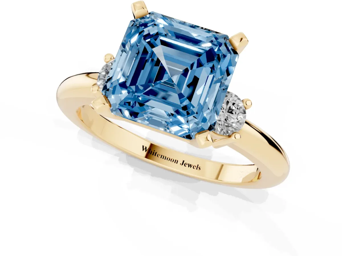 Fancy Blue Three-Stone Asscher Cut Cut Diamond Solitaire with Prong Setting and Classic Band Yellow gold