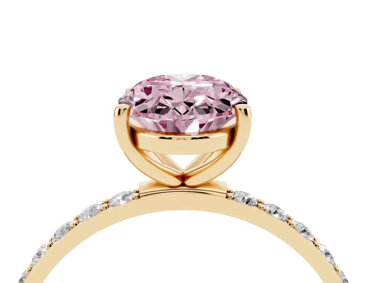Fancy Pink Oval Cut Diamond Solitaire Ring with Round Pavé Shoulders and Prong Setting Yellow gold
