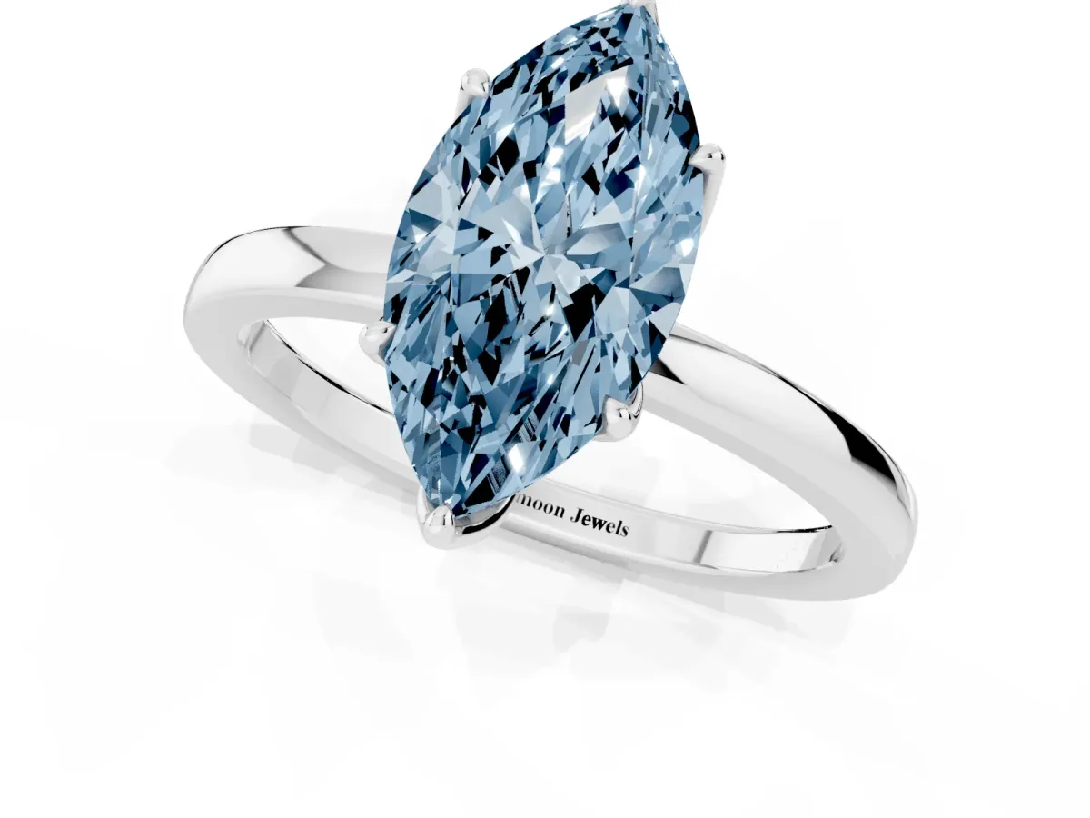 Fancy Blue Marquise Cut Diamond Solitaire Ring with Thin Band and Prong Setting Platinum
