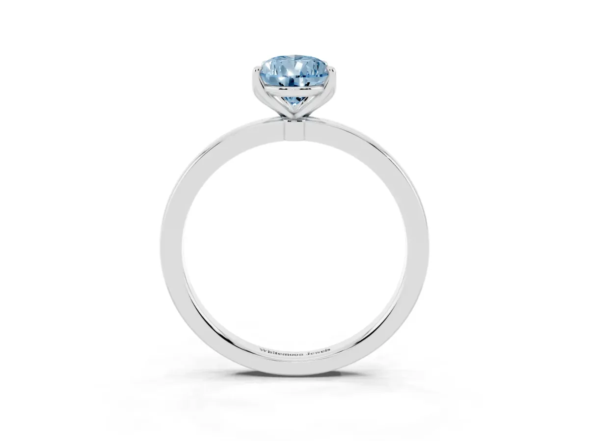 Fancy Blue Pear Cut Diamond Solitaire Ring with Thin Band and Prong Setting Silver
