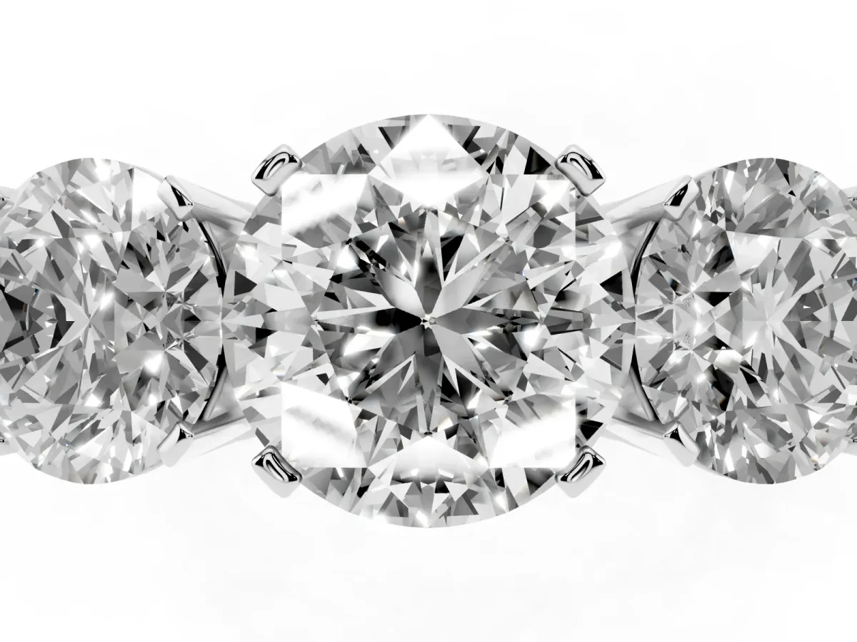 Three-Stone Round Cut Cut Diamond Ring with Channel Set Band and Four-Prong Setting Platinum