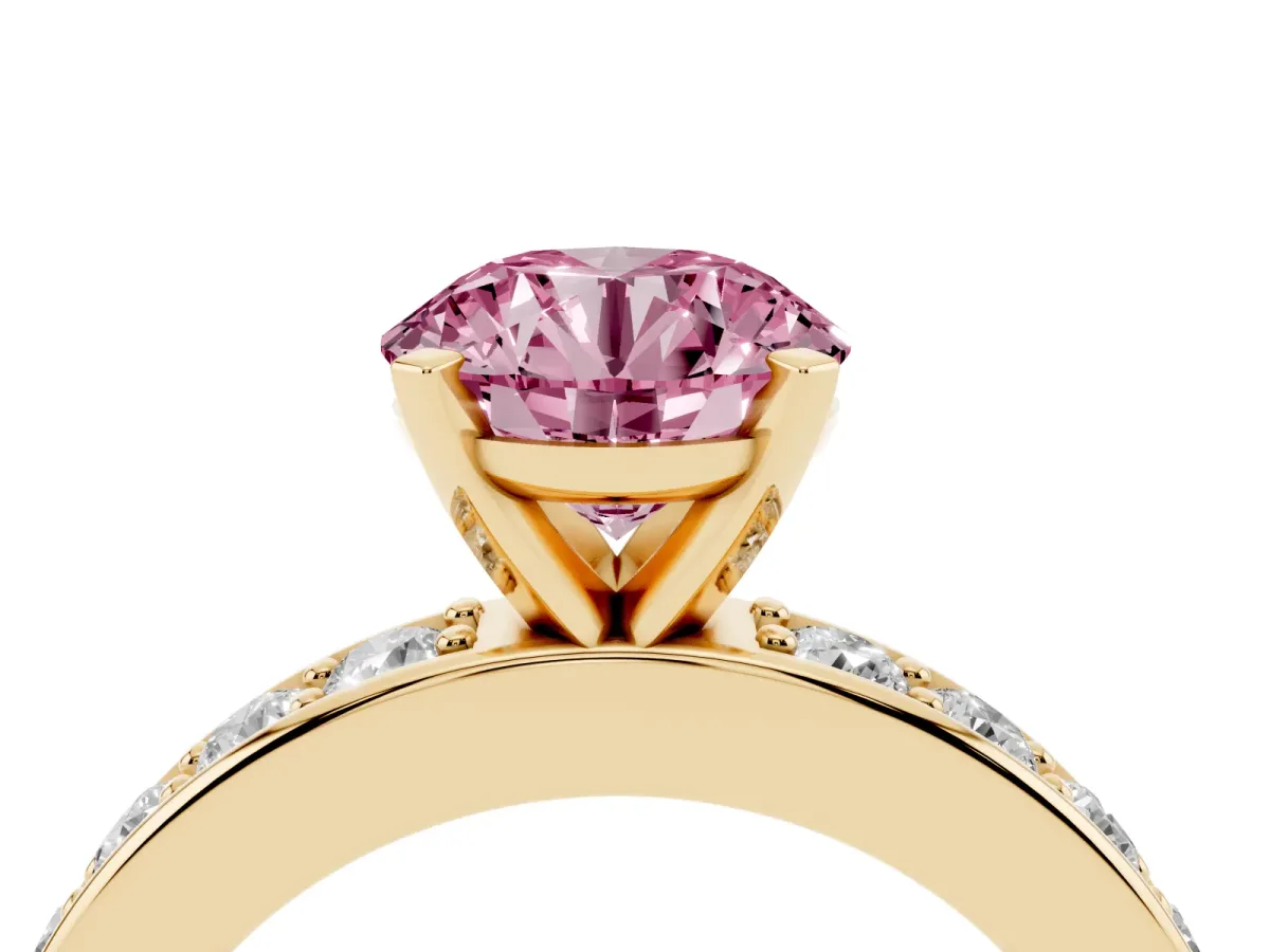 Fancy Pink Round Cut Diamond Engagement Ring with Channel Set Round Band and Prong Setting Yellow gold