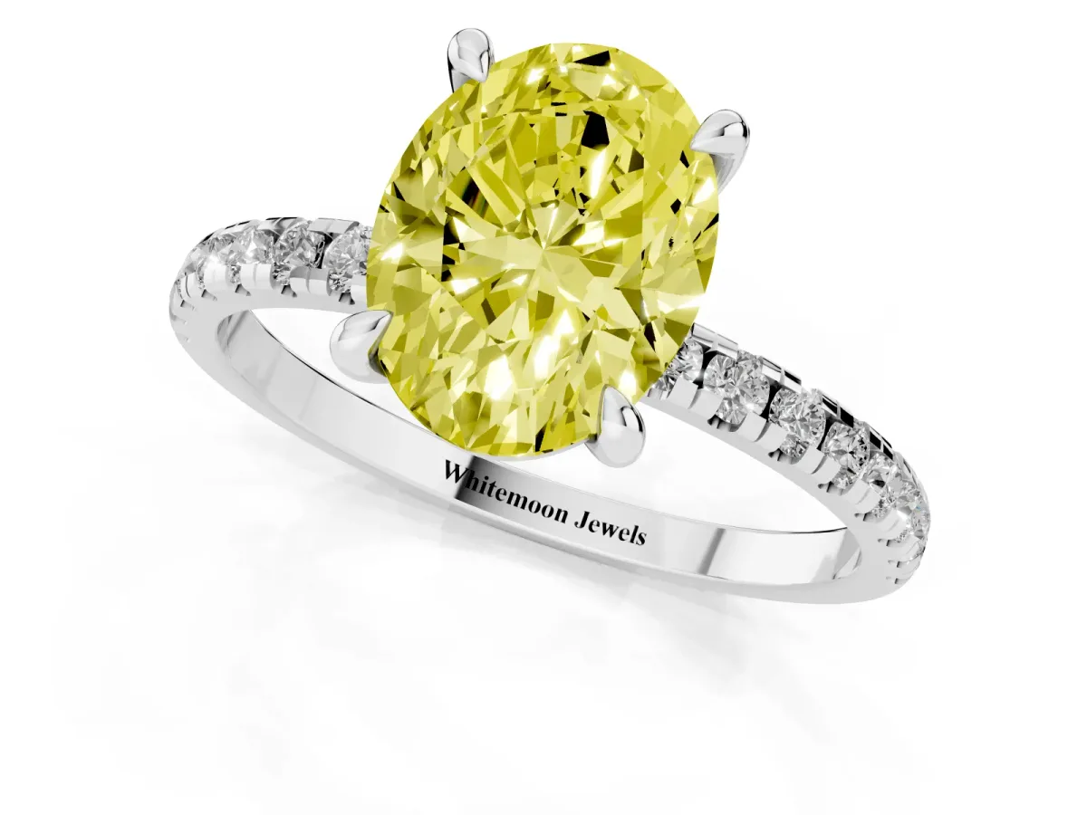 Fancy Yellow Oval Cut Diamond Brilliant Solitaire Ring with Pavé Band and Four-Prong Setting Silver