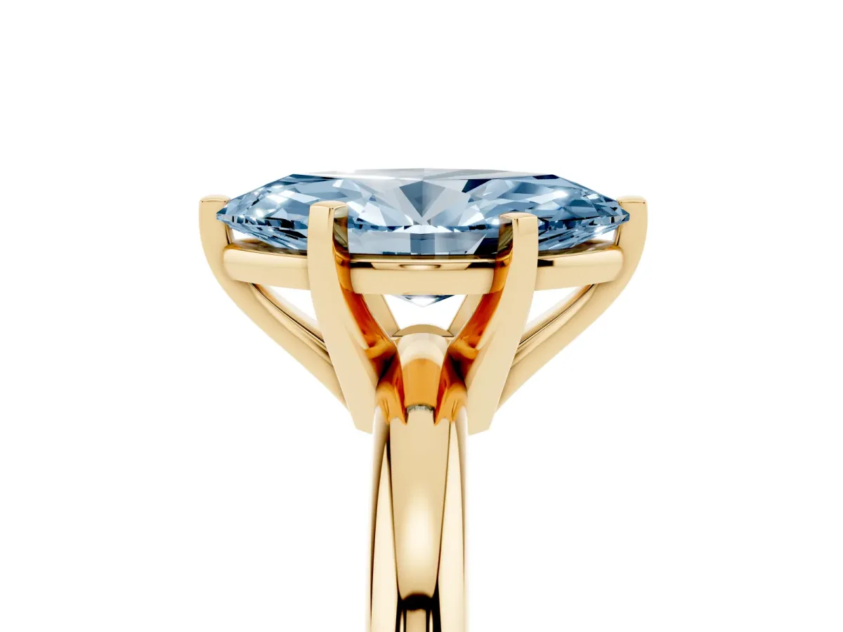 Fancy Blue Marquise Cut Diamond Solitaire Engagement Ring with Round Band and Four-Prong Setting Yellow gold
