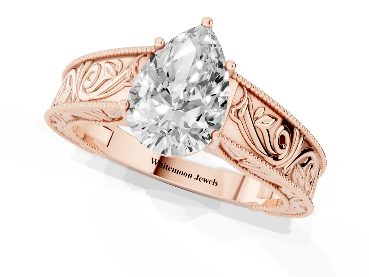 Pear Cut Diamond Solitaire Ring with Engraved Band and Four-Prong Setting Rose gold