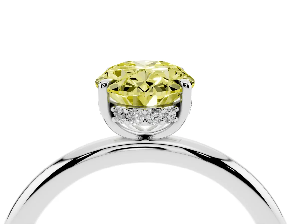Fancy Yellow Oval Cut Diamond Solitaire Ring with Thin Band and Four-Prong Setting Silver