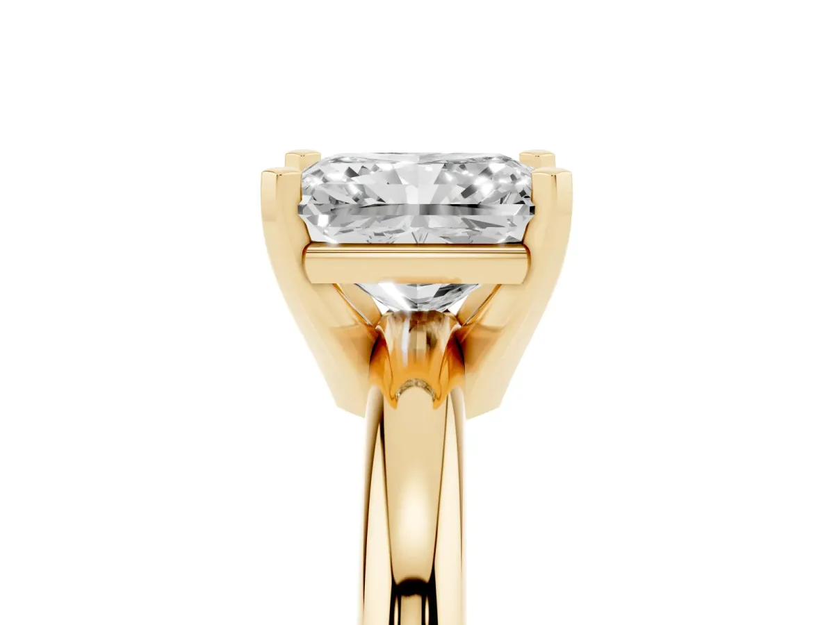 Radiant Cut Diamond Solitaire Engagement Ring with Round Band and Four-Prong Setting Yellow gold