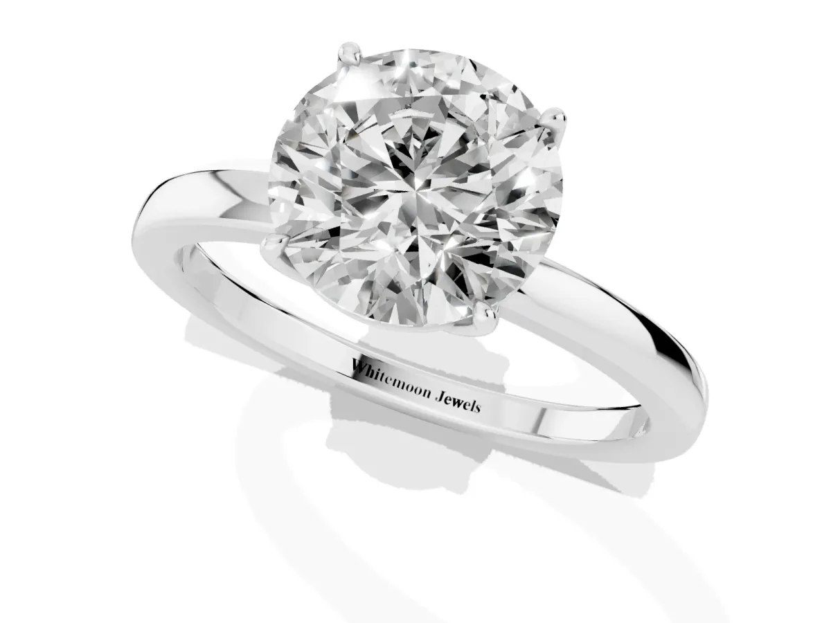 Round Cut Diamond Solitaire Ring with Thin Band and Prong Setting Platinum