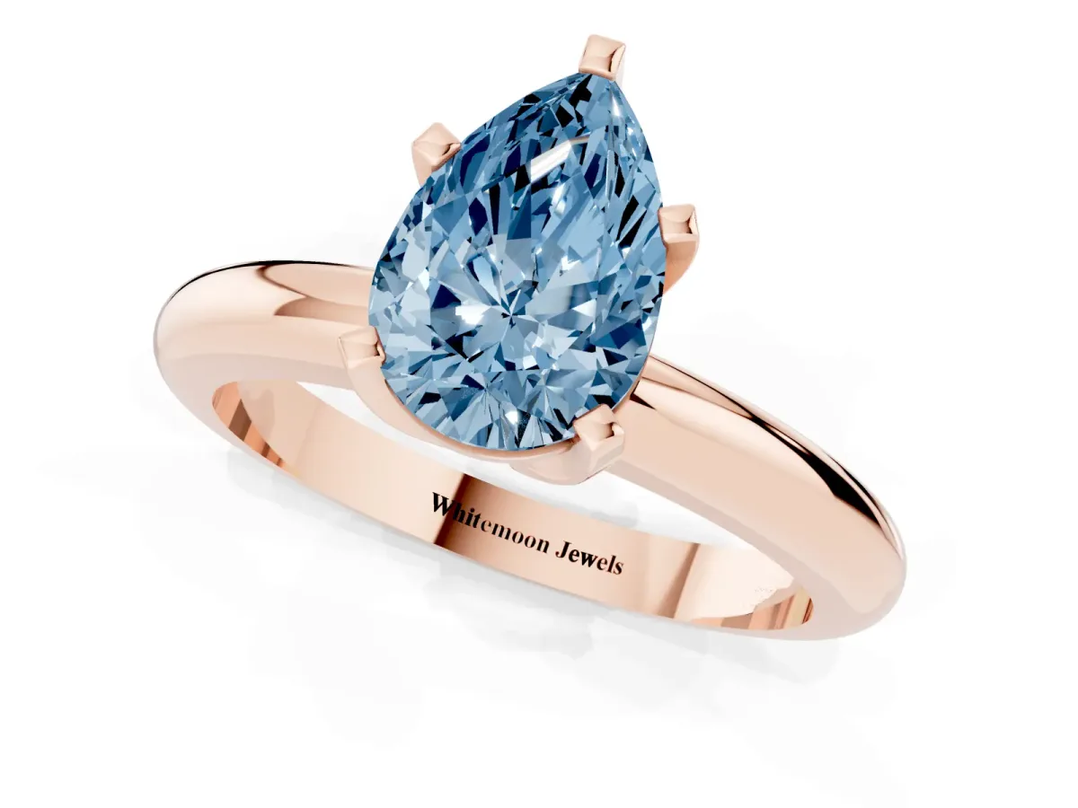 Fancy Blue Pear Cut Diamond Solitaire Engagement Ring with Round Band and Four-Prong Setting Rose gold
