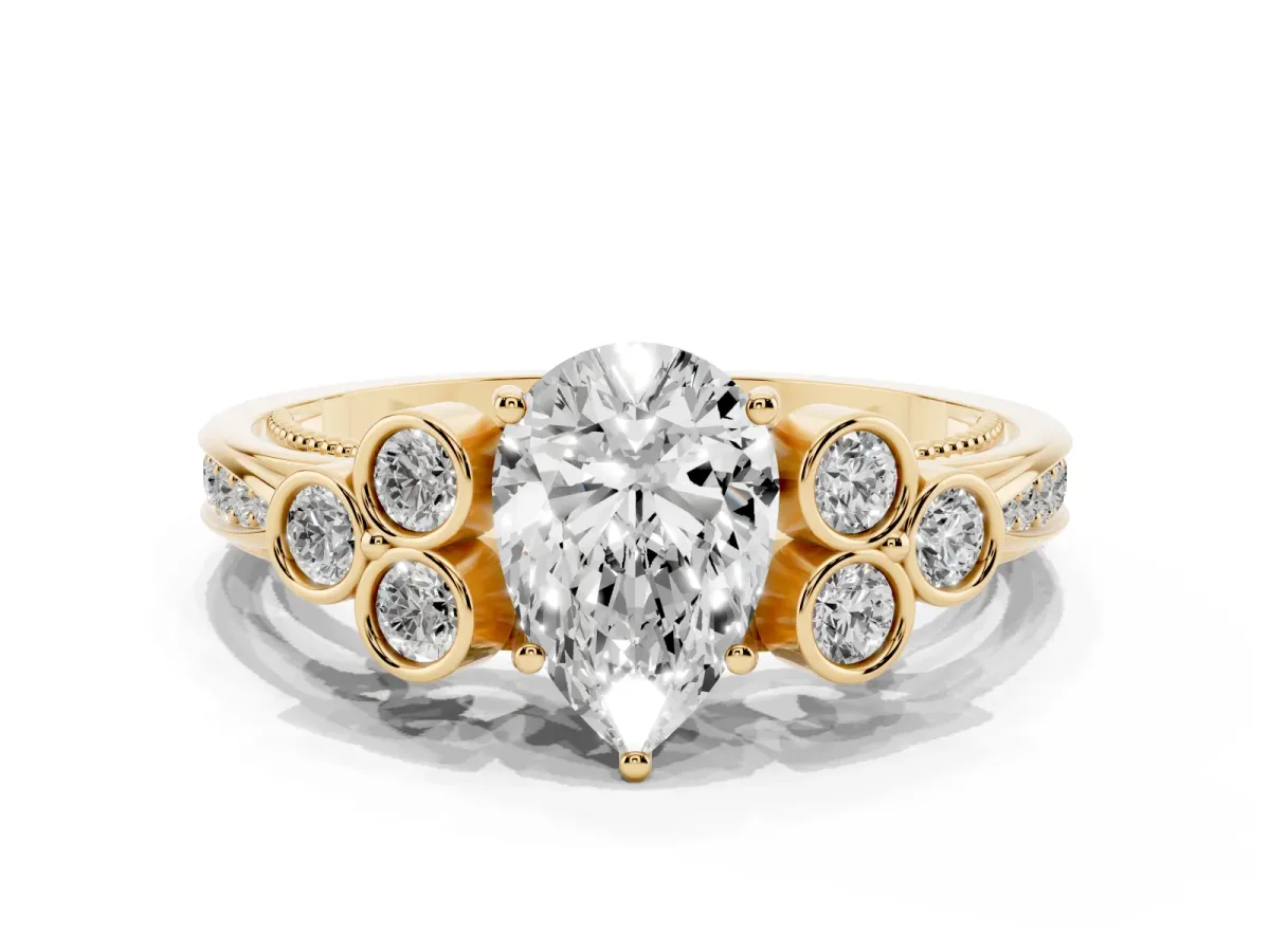 Pear Cut Cut Diamond Engagement Ring with Bezel Set Round Side Stones and Prong Setting Yellow gold