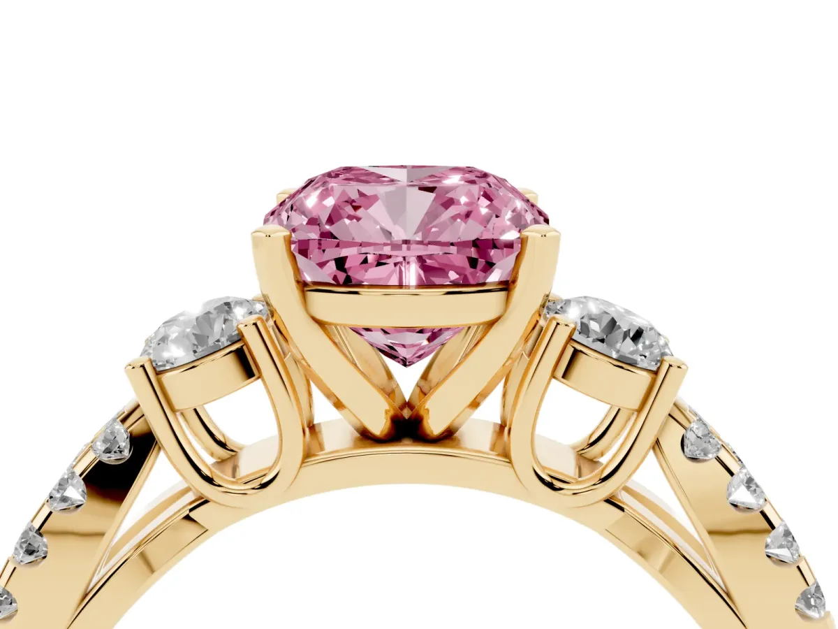 Fancy Pink Cushion Cut Diamond Three-Stone Ring with Pavé Split Shank and Four-Prong Setting Yellow gold