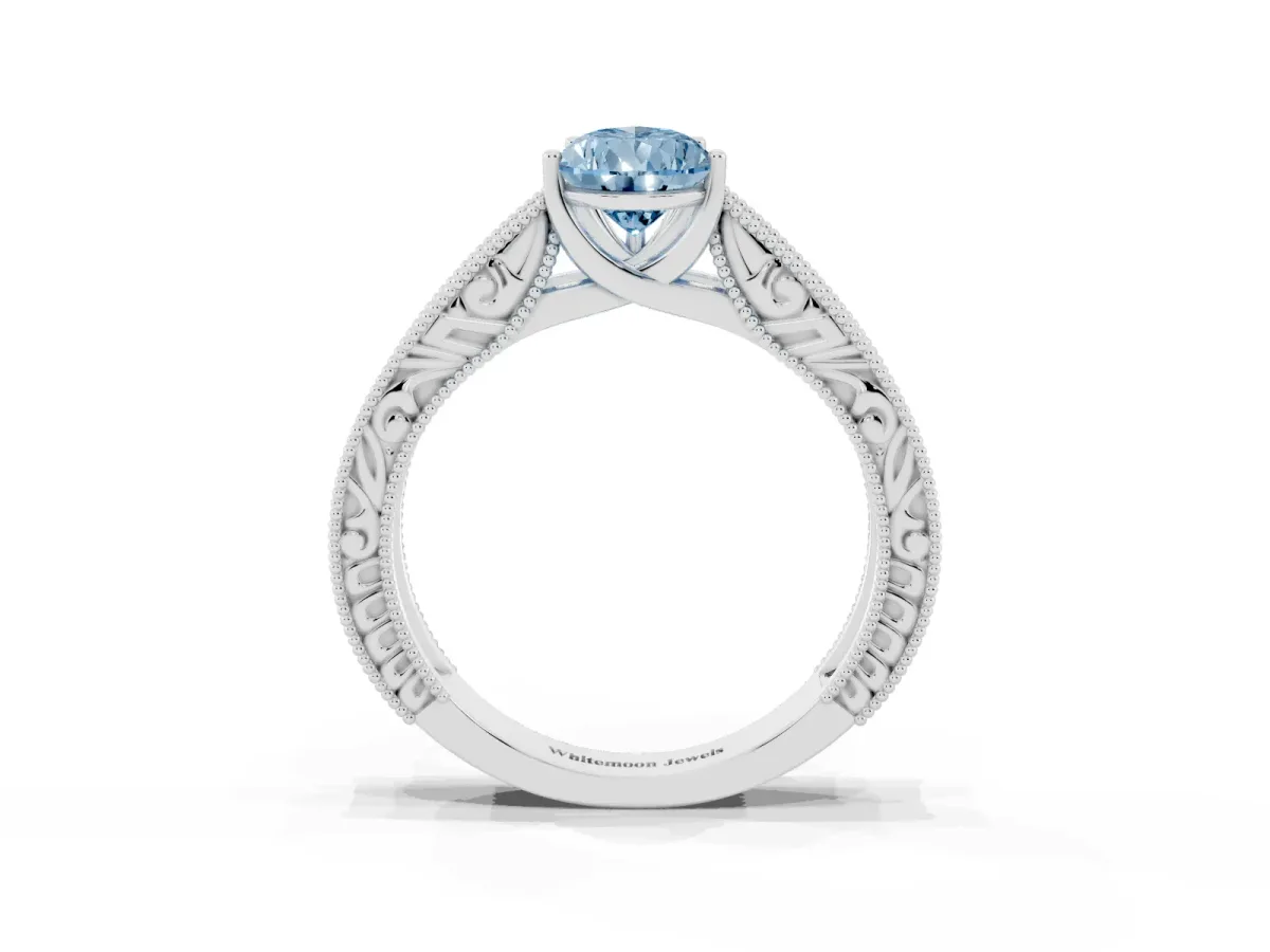 Fancy Blue Pear Cut Diamond Solitaire Ring with Engraved Band and Four-Prong Setting White gold