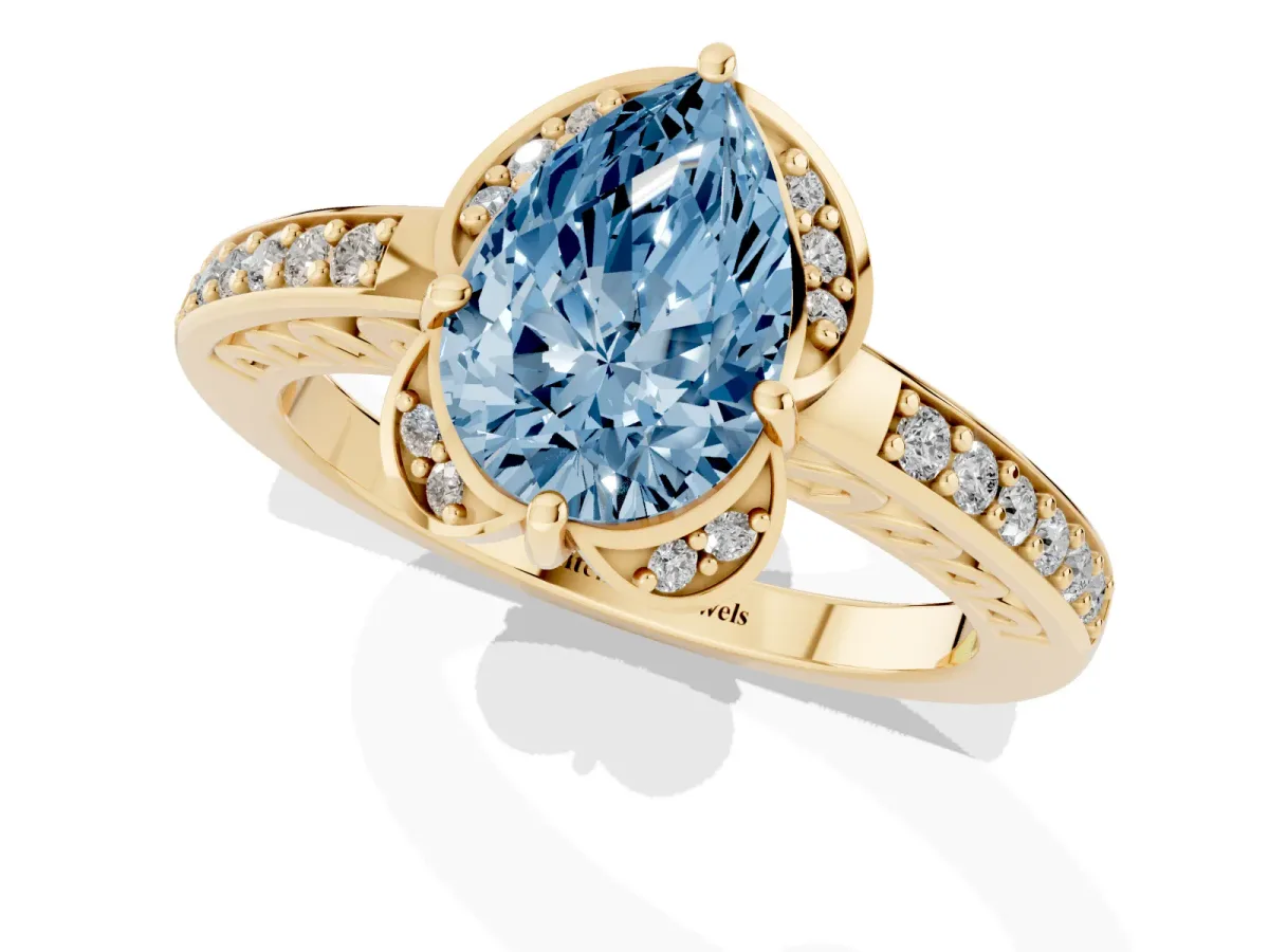 Fancy Blue Pear Cut Cut Halo Diamond Ring with Channel Set Band and Four-Prong Setting Yellow gold