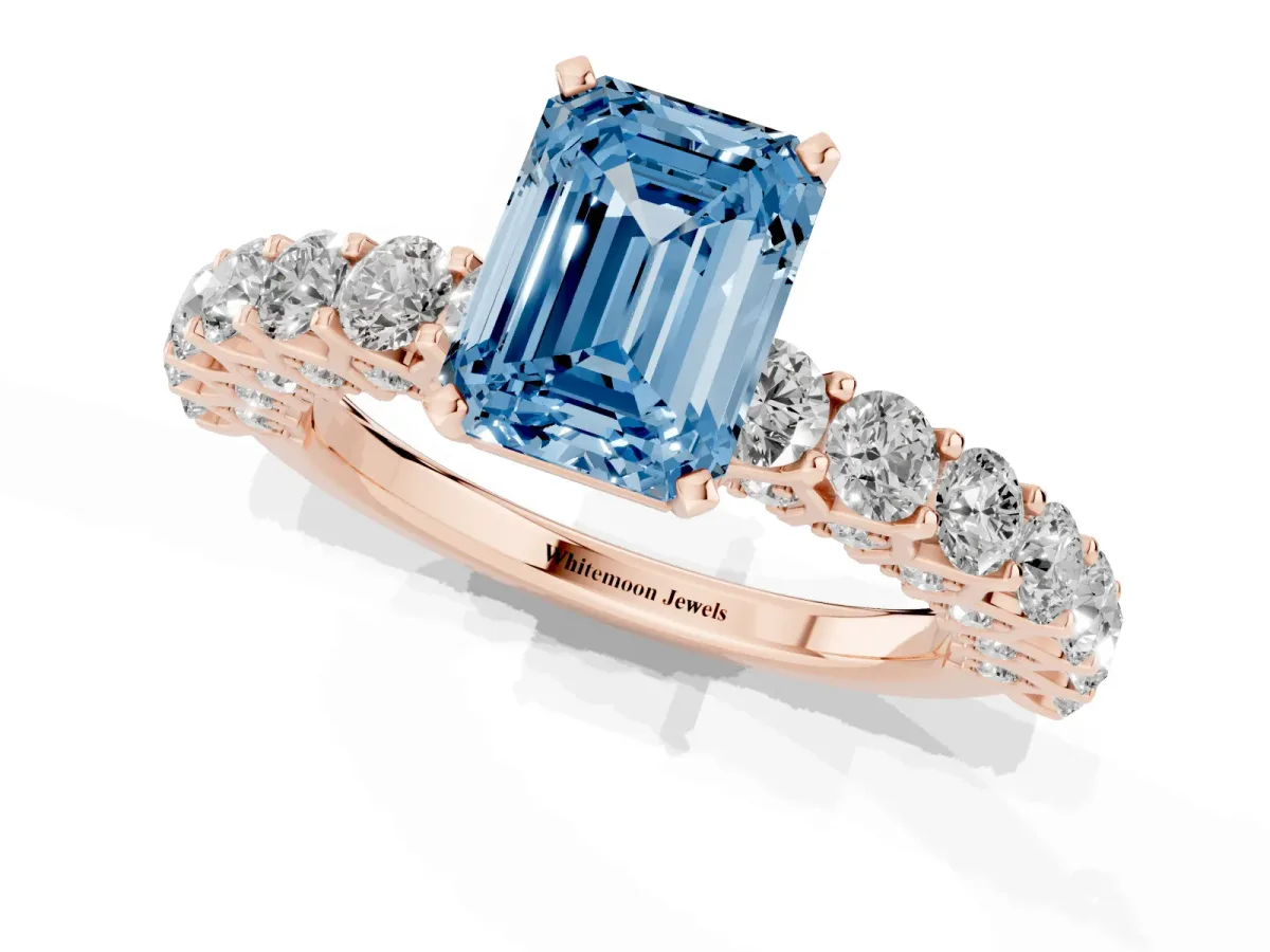 Fancy Blue Emerald Cut Diamond Solitaire Ring with Shared Prong Pavé Band and Four-Prong Setting Rose gold