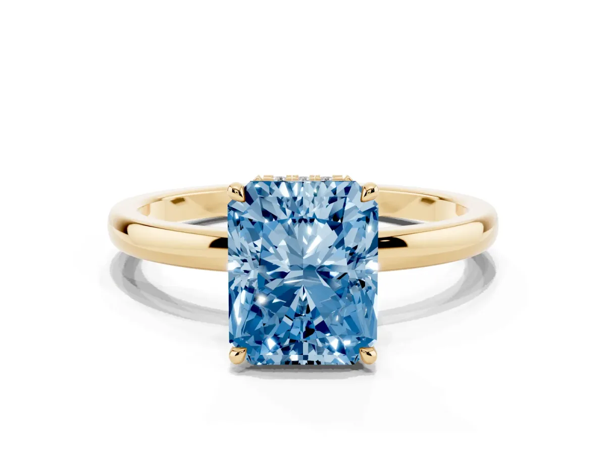 Fancy Blue Radiant Cut Solitaire Engagement Ring with Cathedral Band and Four-Prong Setting Yellow gold