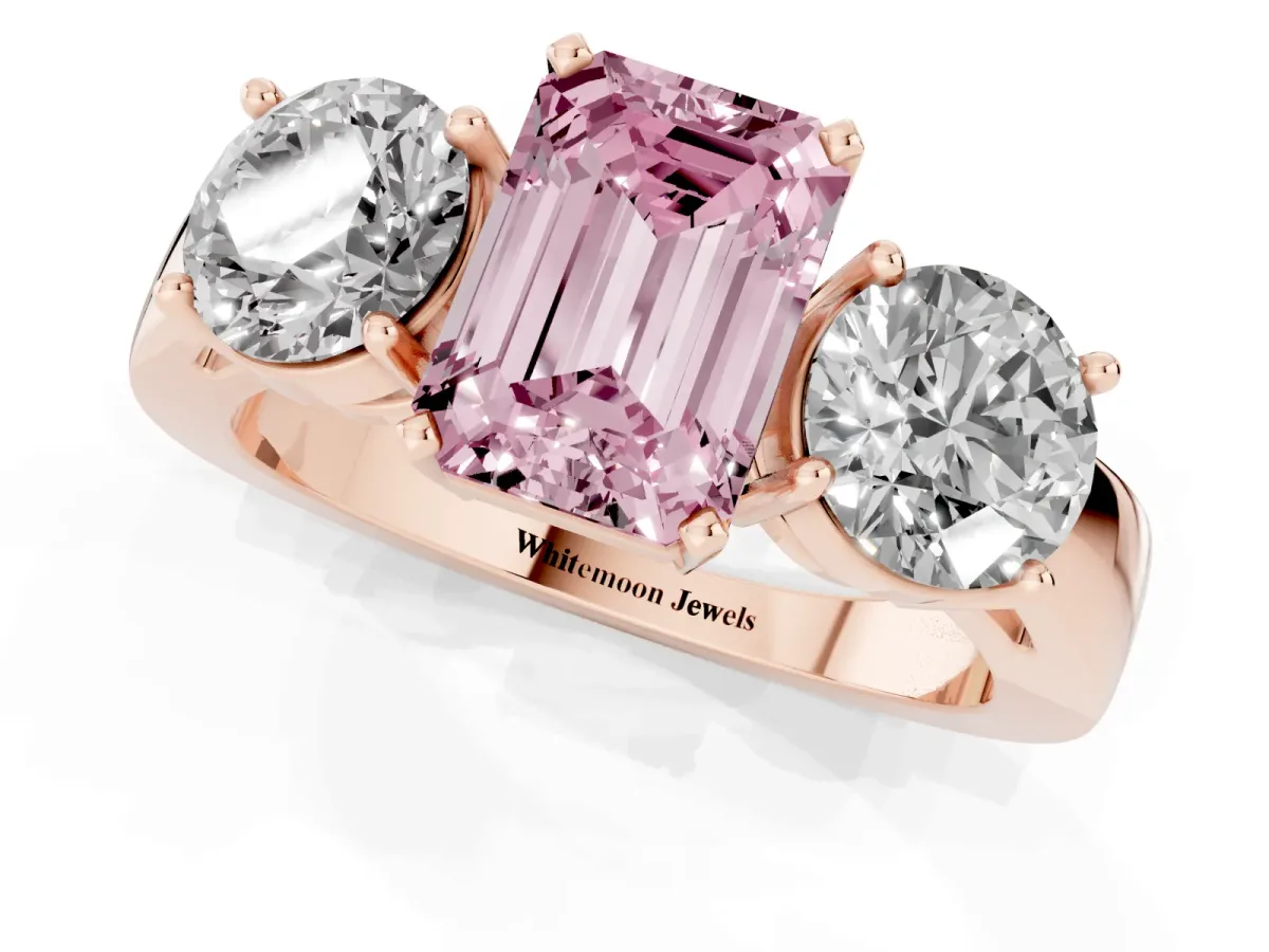Fancy Pink Three-Stone Emerald Cut Diamond Ring with Round Side Stones, Classic Band, and Four-Prong Setting Rose gold
