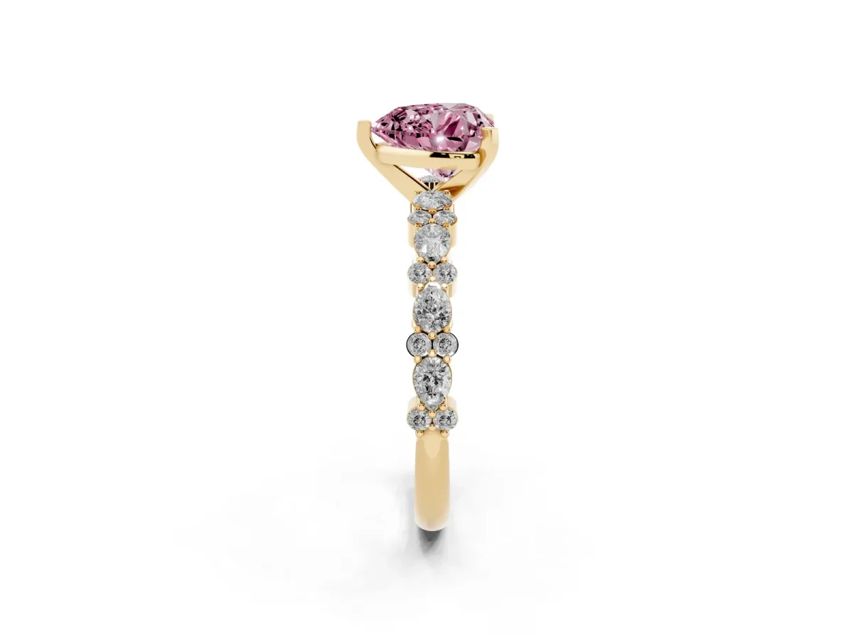 Fancy Pink Heart Cut Diamond Side Stone Solitaire Ring with Round and Four-Prong Setting Yellow gold