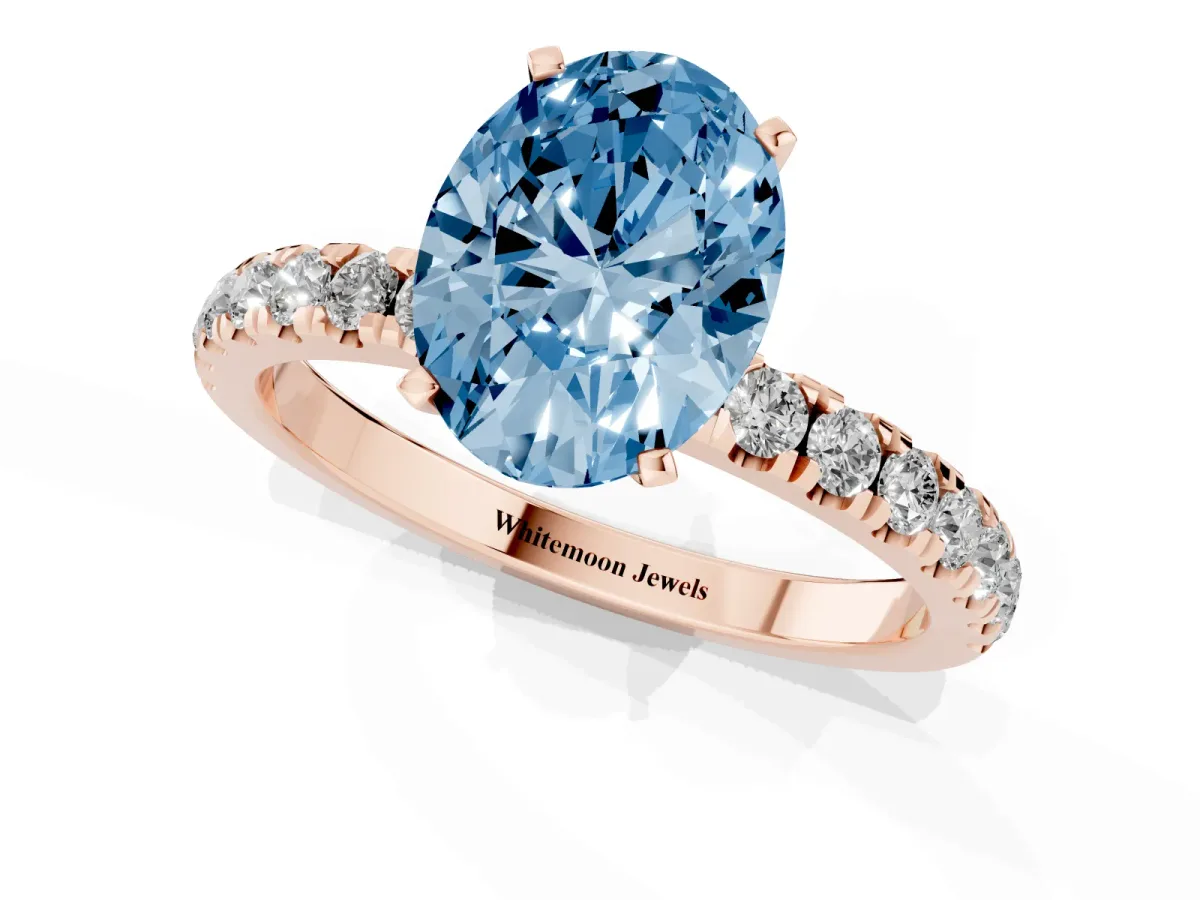 Fancy Blue Oval Cut Diamond Solitaire Ring with Pavé Accents and Four-Prong Setting Rose gold