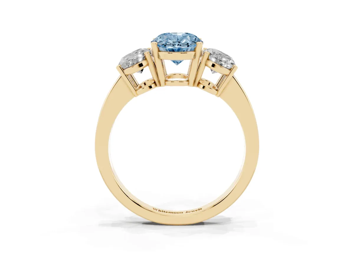 Fancy Blue Three-Stone Oval Cut Cut Diamond Engagement Ring with Flat Band and Four-Prong Setting Yellow gold