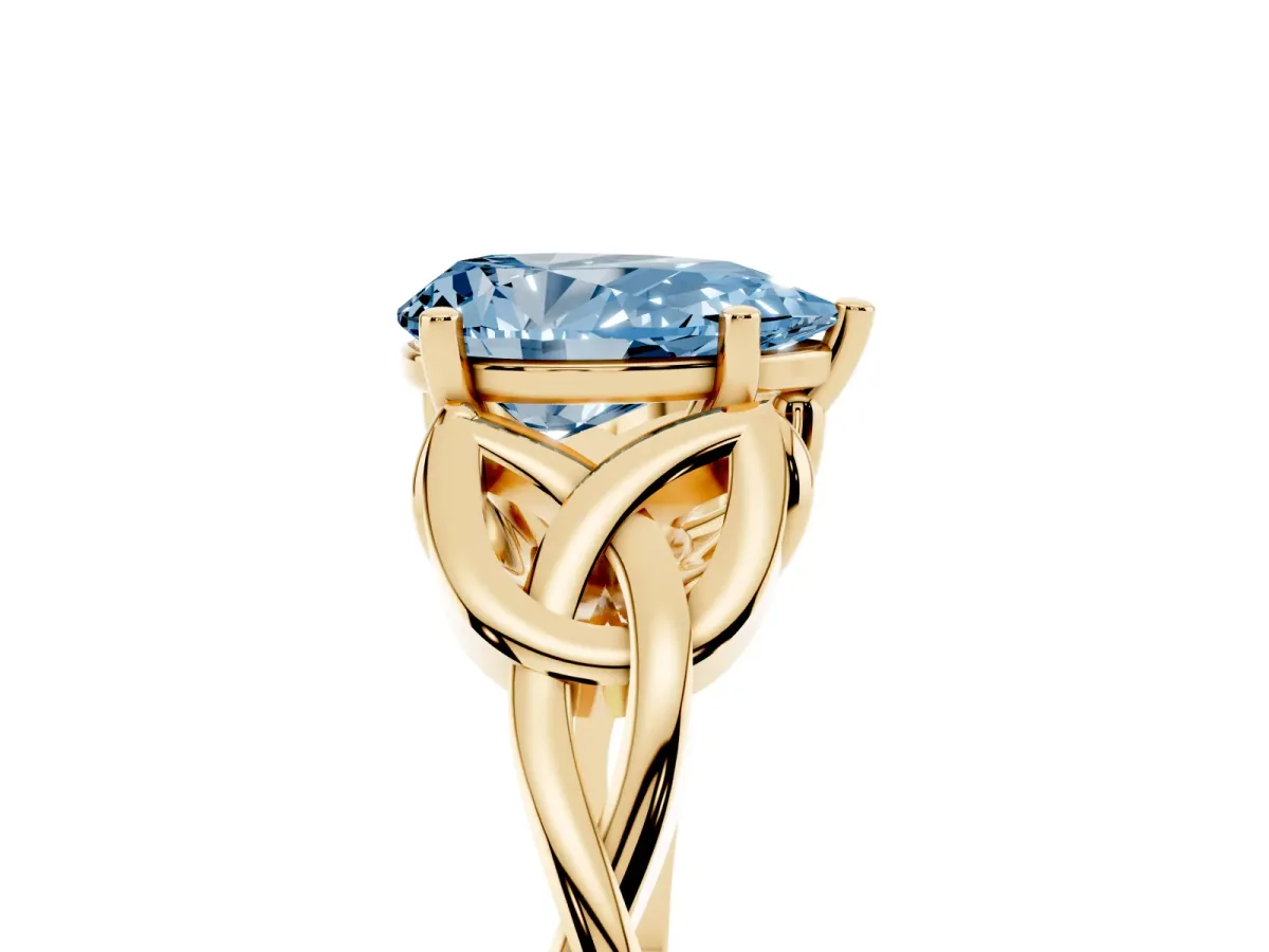 Fancy Blue Pear Cut Diamond Solitaire Engagement Ring with Celtic Knot Band and Four-Prong Setting Yellow gold