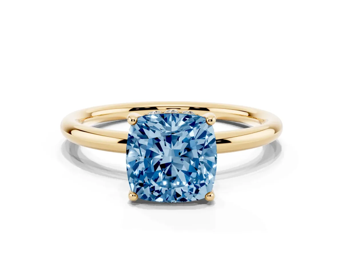 Fancy Blue Cushion Cut Solitaire Diamond Ring with a Classic Band and Four-Prong Setting Yellow gold